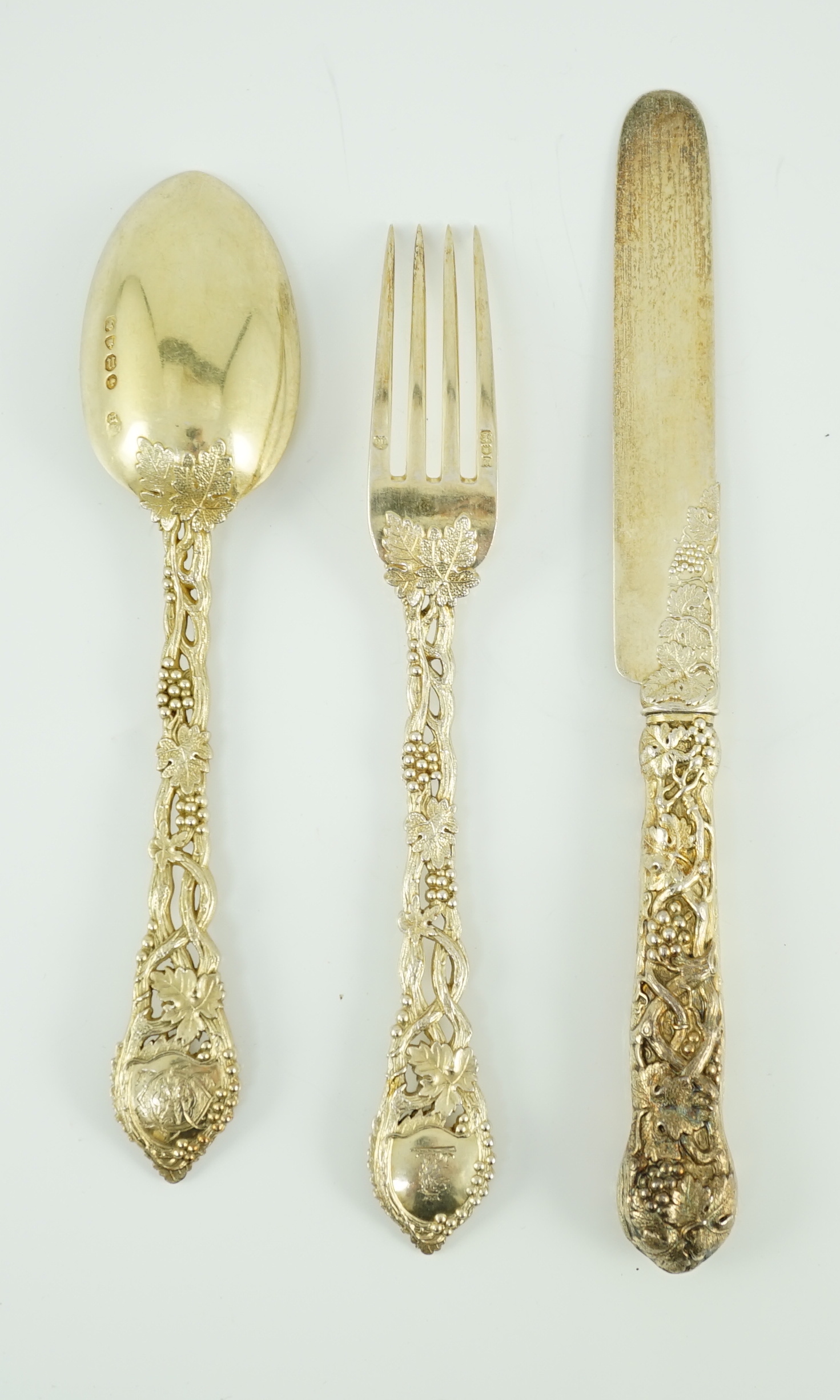 A Victorian and later matched silver gilt part canteen of dessert cutlery by Francis Higgins II & III